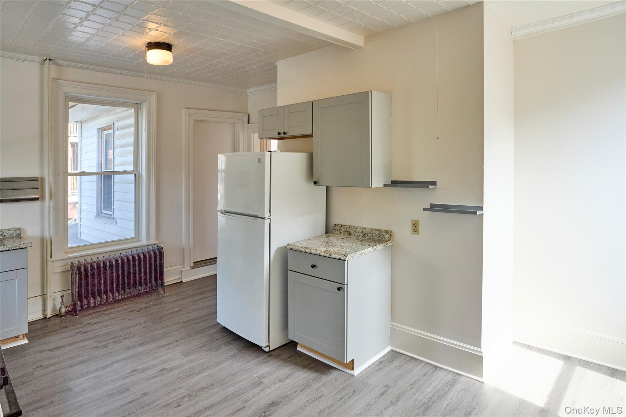 457 Main Street, Unit 3 Beacon, NY 12508 - Photo 4 of 13 a kitchen with a refrigerator and a sink
