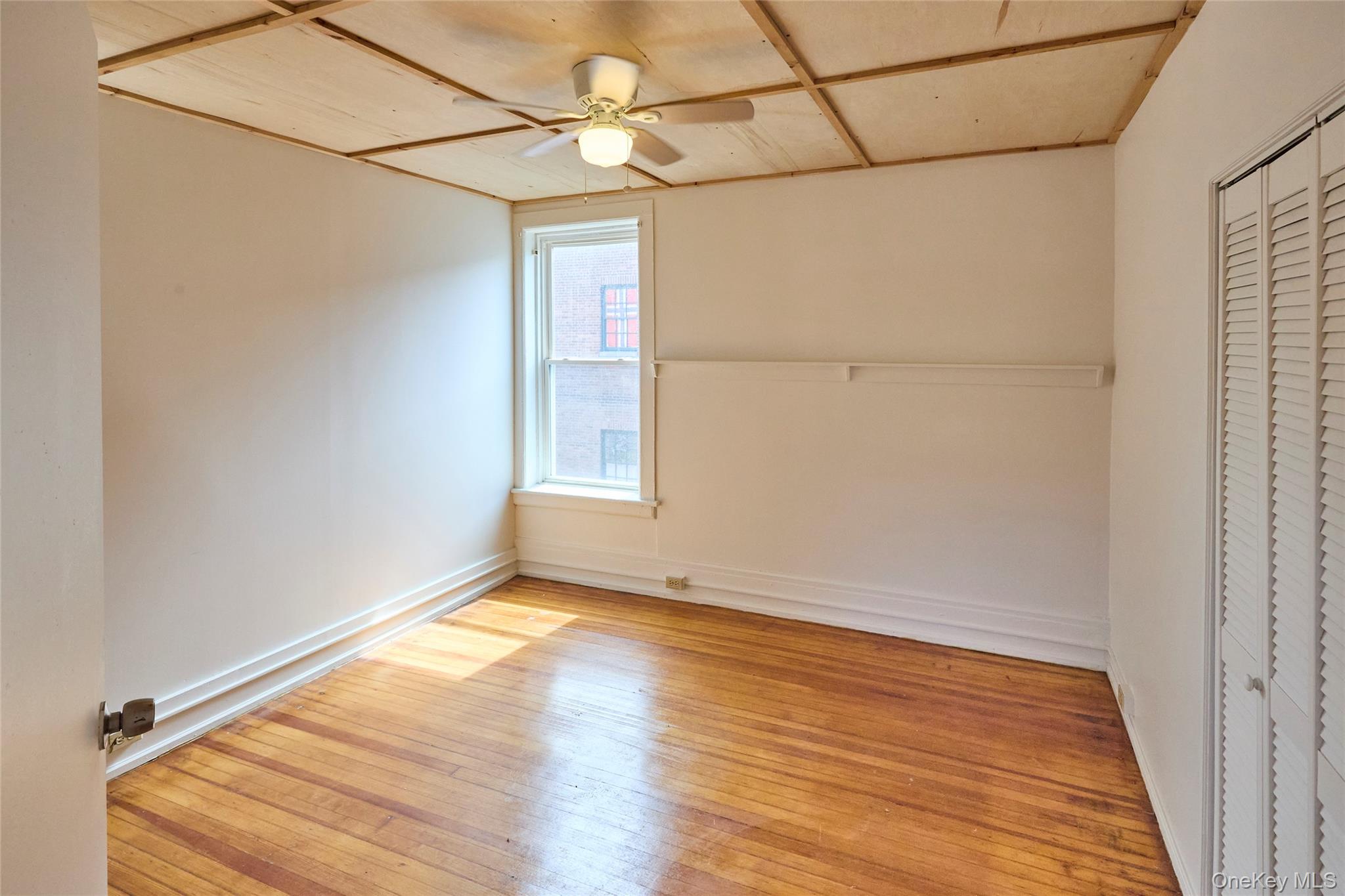 457 Main Street, Unit 3 Beacon, NY 12508 - Photo 7 of 13 a view of a room with wooden floor and white walls