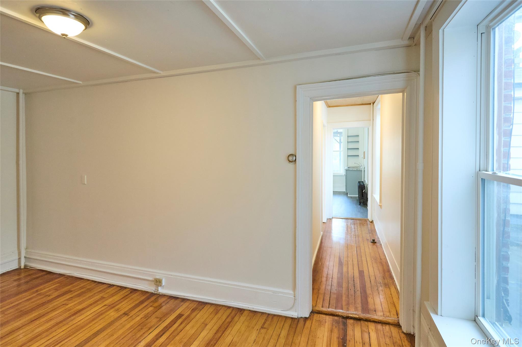 457 Main Street, Unit 3 Beacon, NY 12508 - Photo 8 of 13 a view of a room with wooden floor