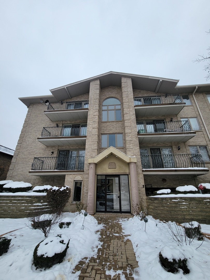 10418 South Keating Avenue, Unit 1A Oak Lawn, IL 60453 - Photo 1 of 15 a room with furniture and a fireplace