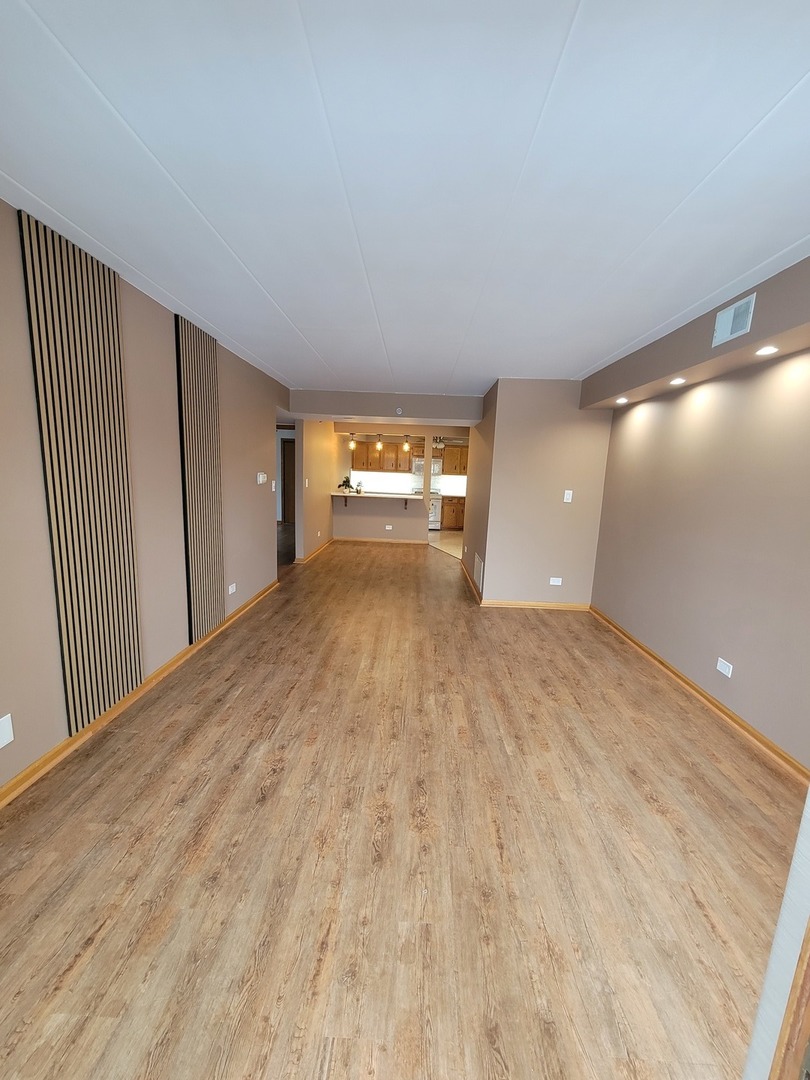 10418 South Keating Avenue, Unit 1A Oak Lawn, IL 60453 - Photo 2 of 15 a view of an empty room and window