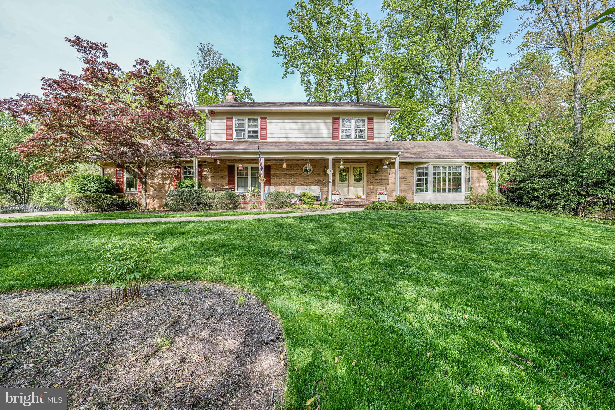 12003 Turf Lane Reston, VA 20191 - Photo 1 of 14 front view of a house with a yard
