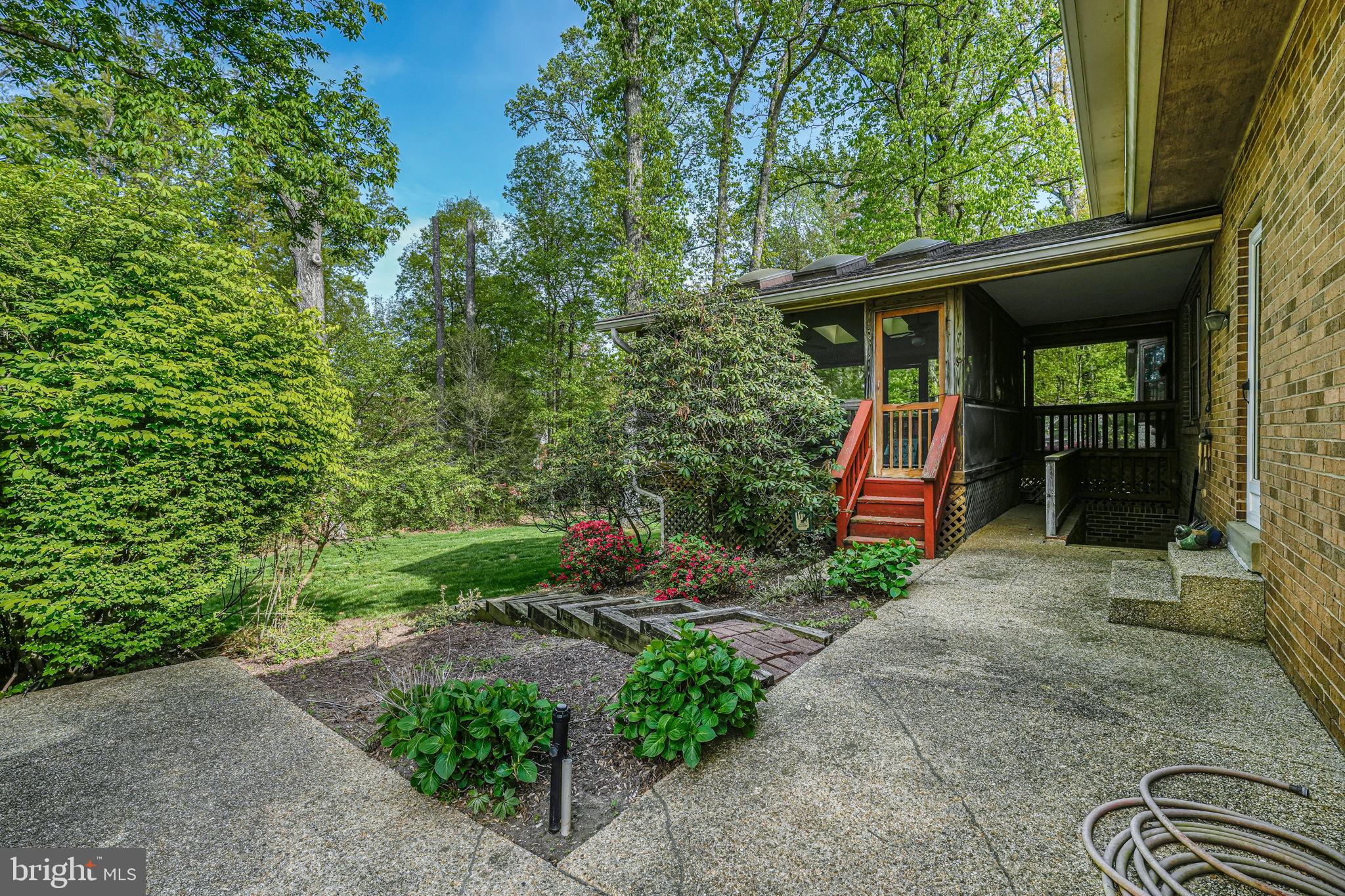 12003 Turf Lane Reston, VA 20191 - Photo 6 of 14 a view of a house with backyard