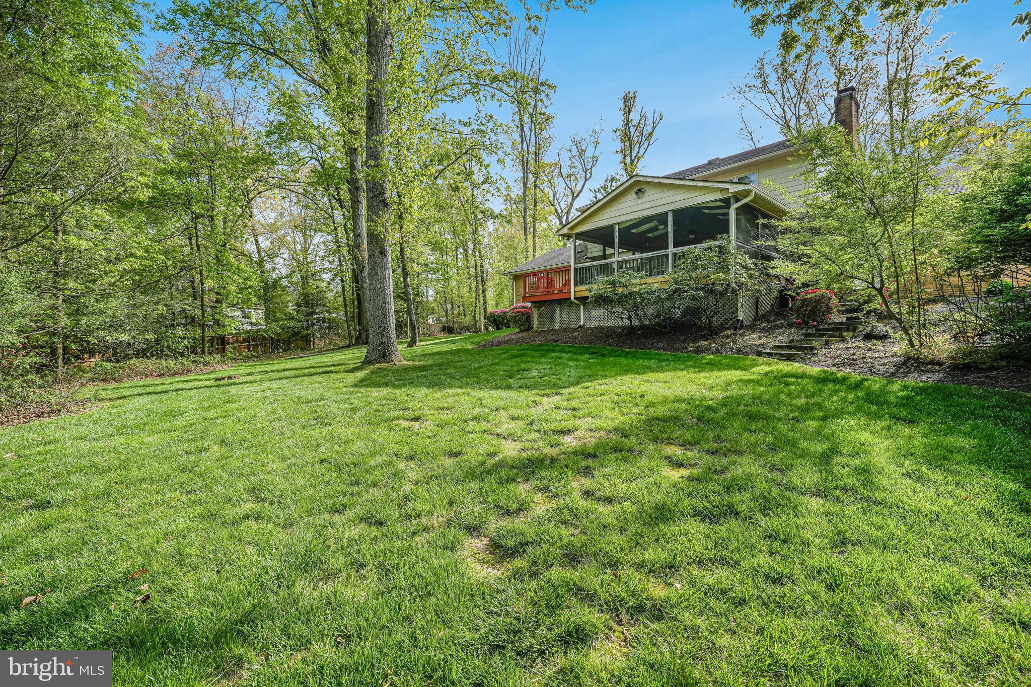 12003 Turf Lane Reston, VA 20191 - Photo 7 of 14 a view of a house with a backyard