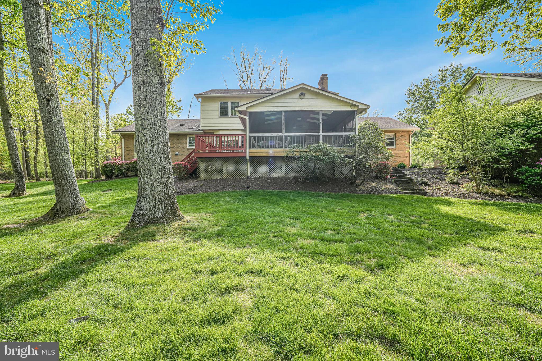 12003 Turf Lane Reston, VA 20191 - Photo 8 of 14 a view of a house with a yard