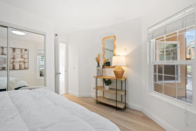 a bedroom with a bed and a window