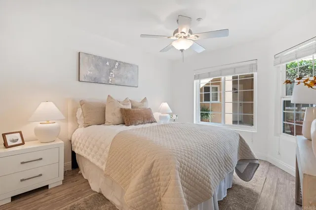 a spacious bedroom with a bed and a window