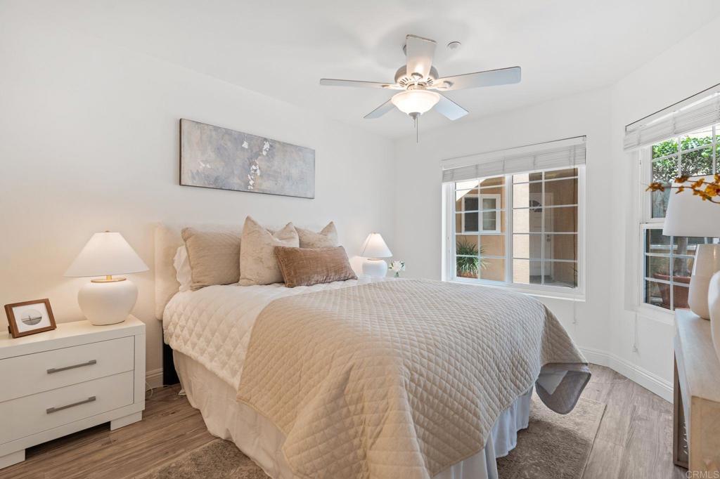 400 The Strand North, Unit 27 Oceanside, CA 92054 - Photo 15 of 25 a spacious bedroom with a bed and a window