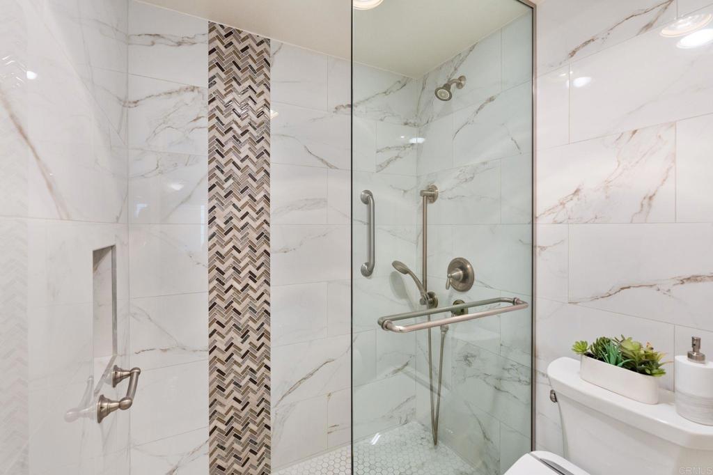 400 The Strand North, Unit 27 Oceanside, CA 92054 - Photo 17 of 25 a bathroom with a shower