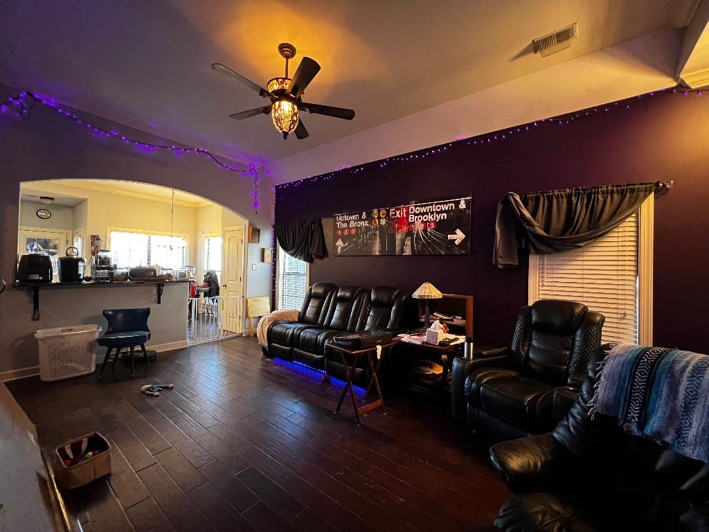 6885 Raleigh Lagrange Road Cordova, TN 38018 - Photo 4 of 6 a living room with furniture and a chandelier