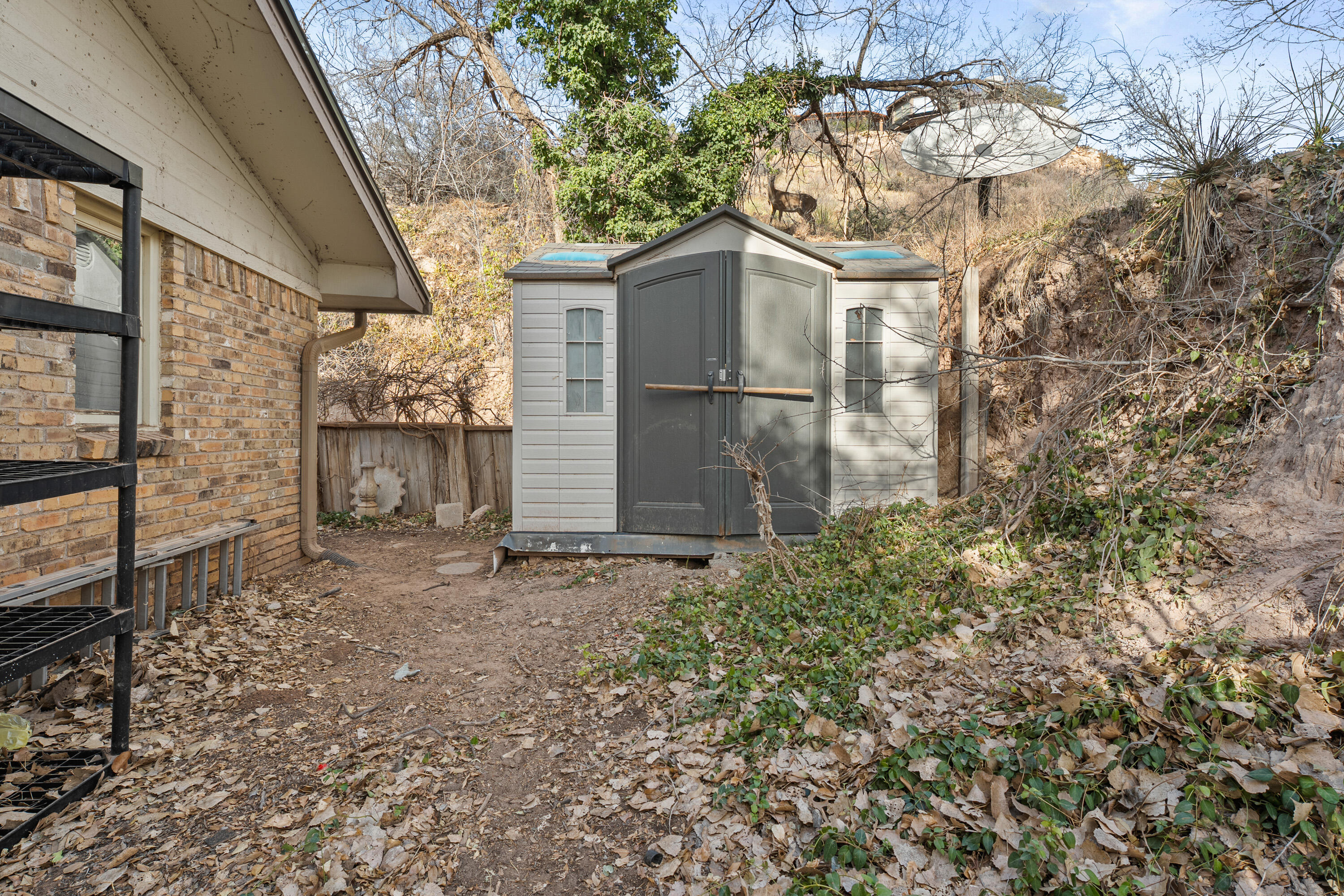 12 Foothill Drive Ransom Canyon, TX 79366 - Photo 18 of 36 a backyard of a house with lots of green space