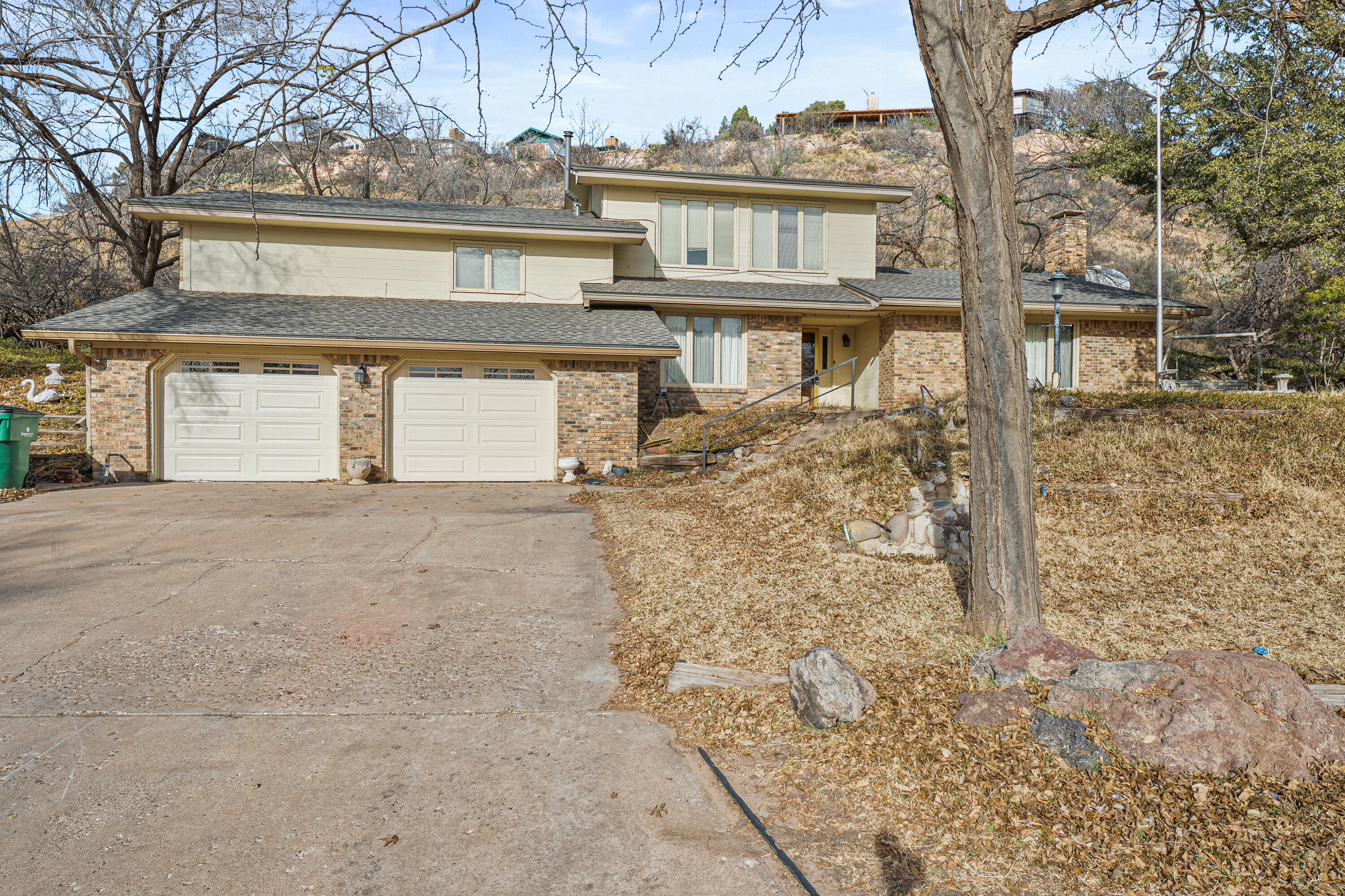 12 Foothill Drive Ransom Canyon, TX 79366 - Photo 2 of 36 front view of house with a dry yard