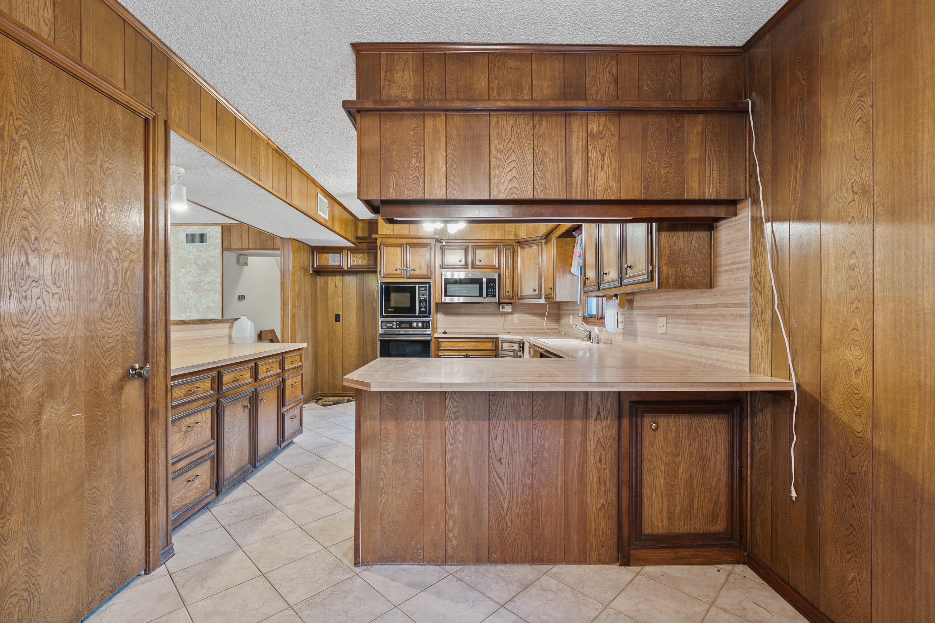 12 Foothill Drive Ransom Canyon, TX 79366 - Photo 24 of 36 a kitchen with stainless steel appliances granite countertop a sink and cabinets