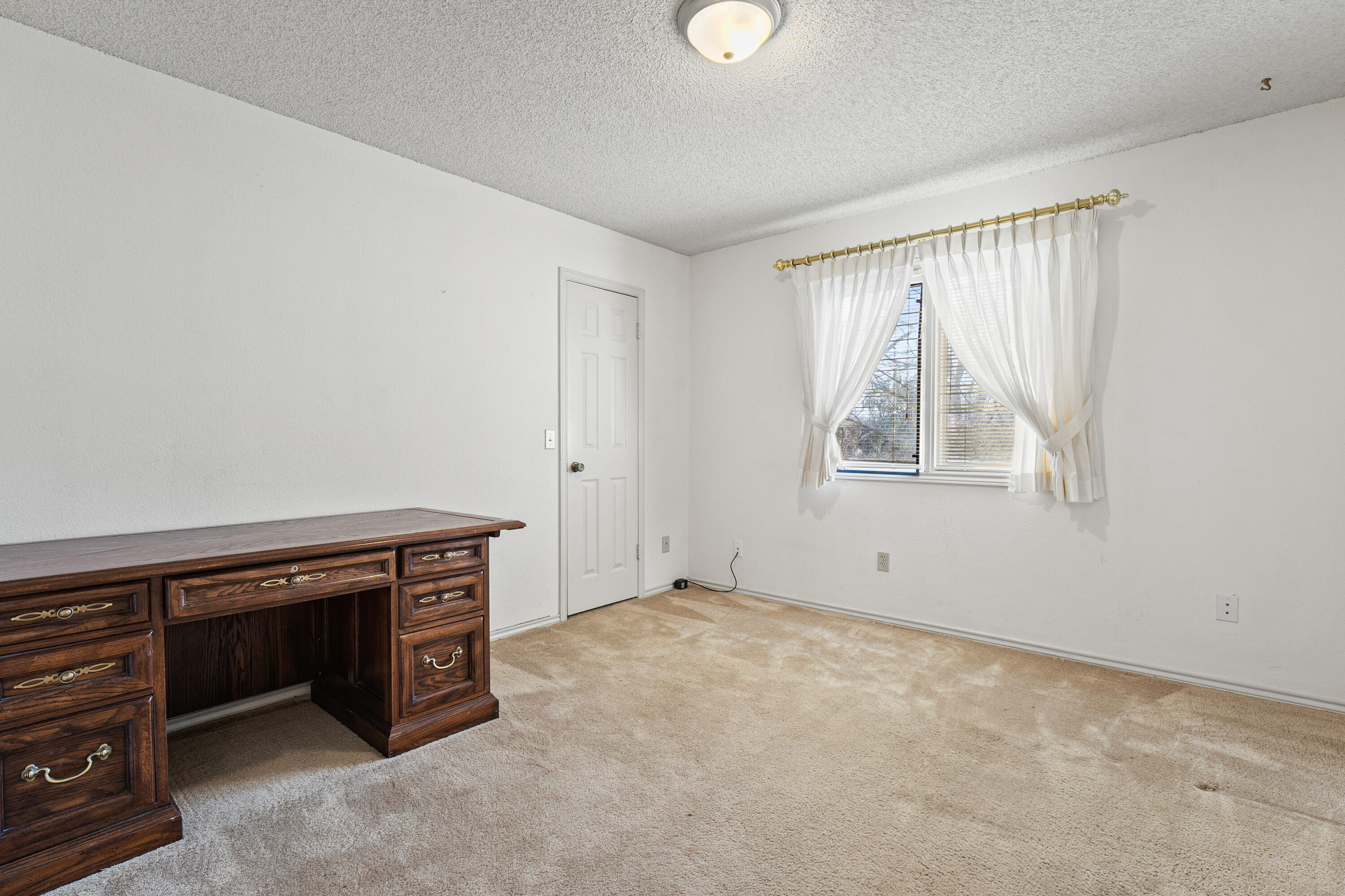 12 Foothill Drive Ransom Canyon, TX 79366 - Photo 28 of 36 an empty room with windows