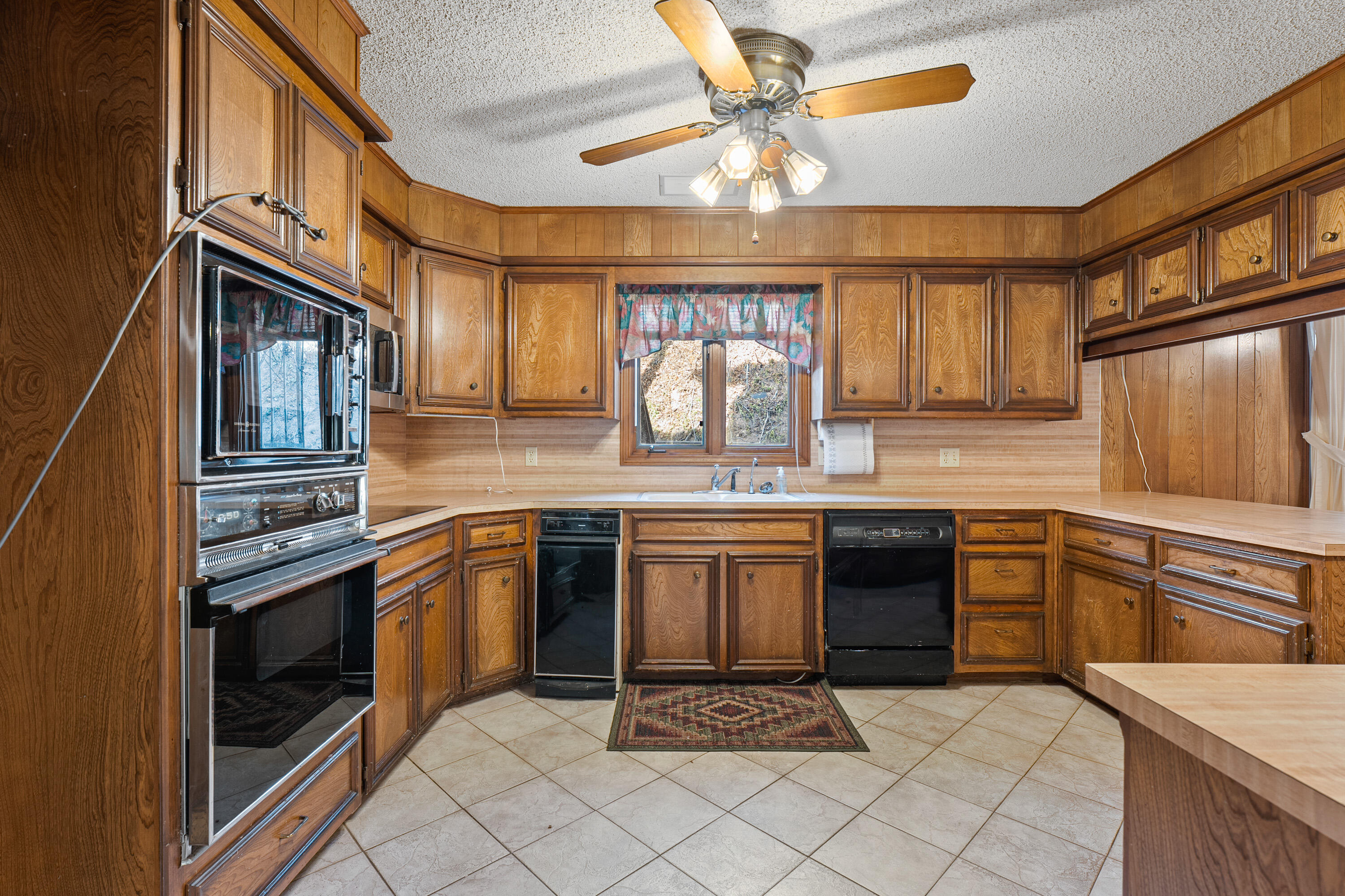 12 Foothill Drive Ransom Canyon, TX 79366 - Photo 10 of 36 a kitchen with stainless steel appliances granite countertop a sink and cabinets