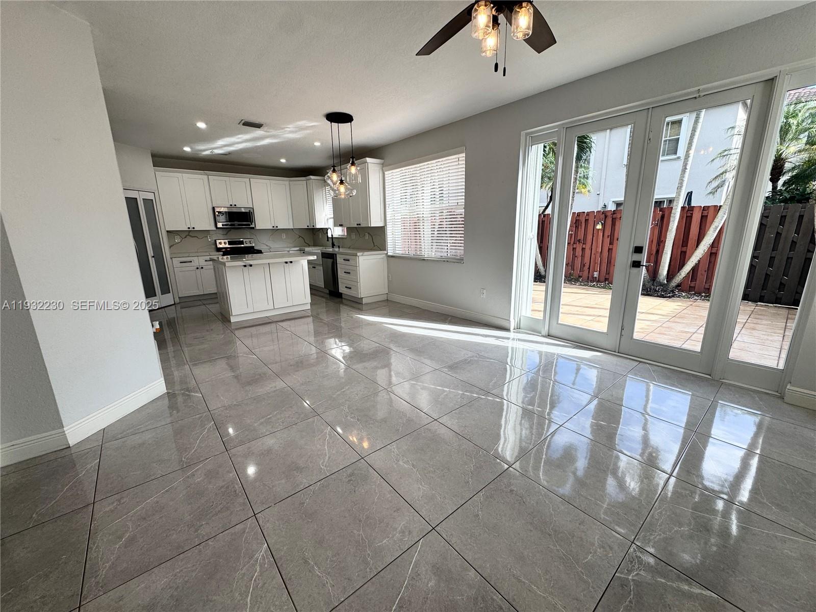 12283 Southwest 123rd Terrace Miami, FL 33186 - Photo 15 of 46 a view of kitchen with furniture and window