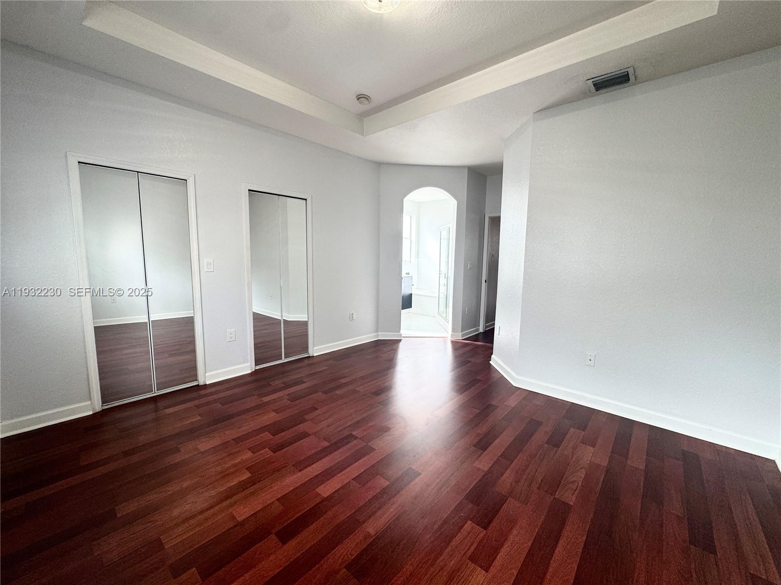 12283 Southwest 123rd Terrace Miami, FL 33186 - Photo 22 of 46 a view of a room with wooden floor and window