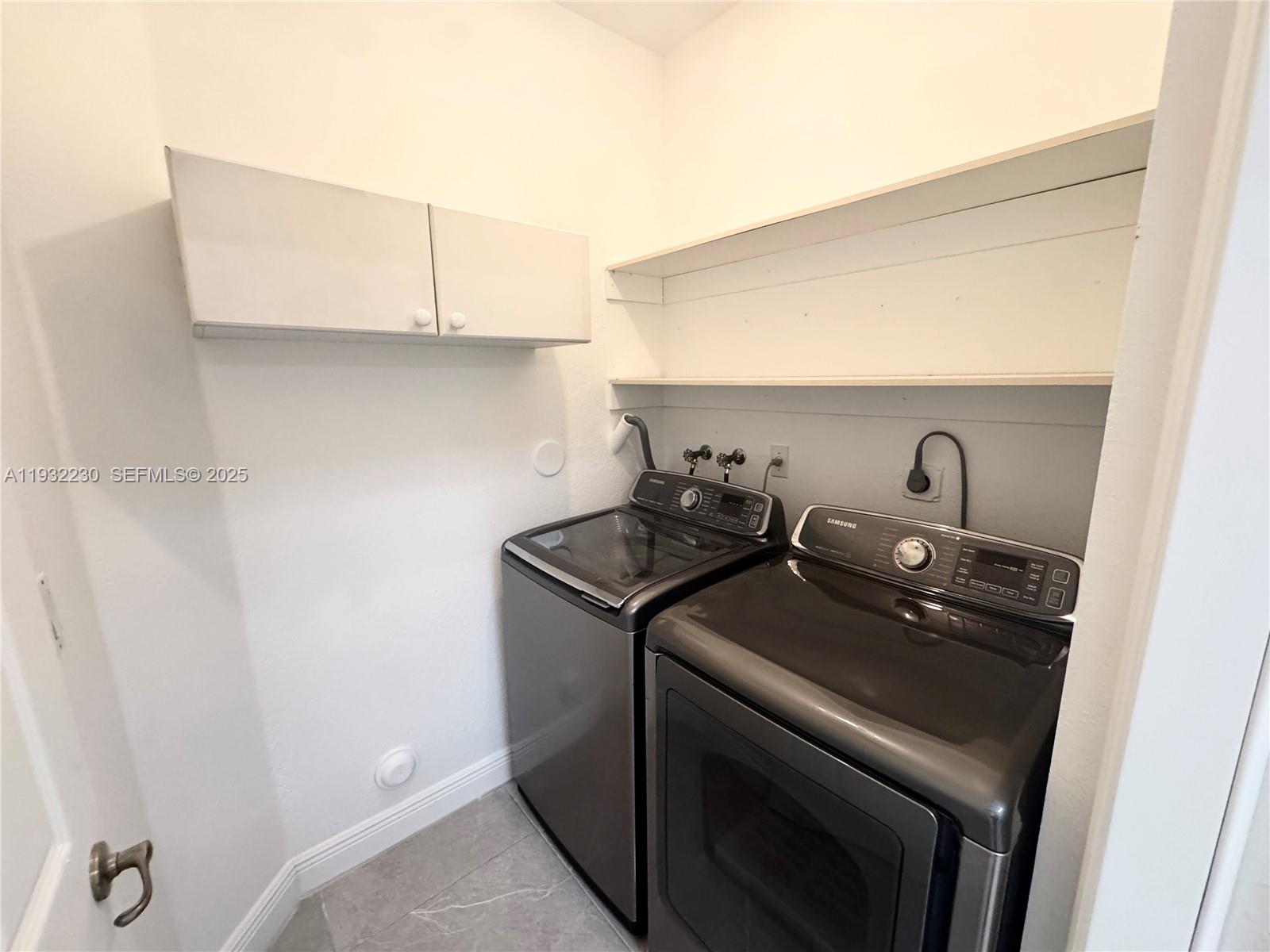 12283 Southwest 123rd Terrace Miami, FL 33186 - Photo 27 of 46 a close up of a stove top oven sitting inside of a kitchen