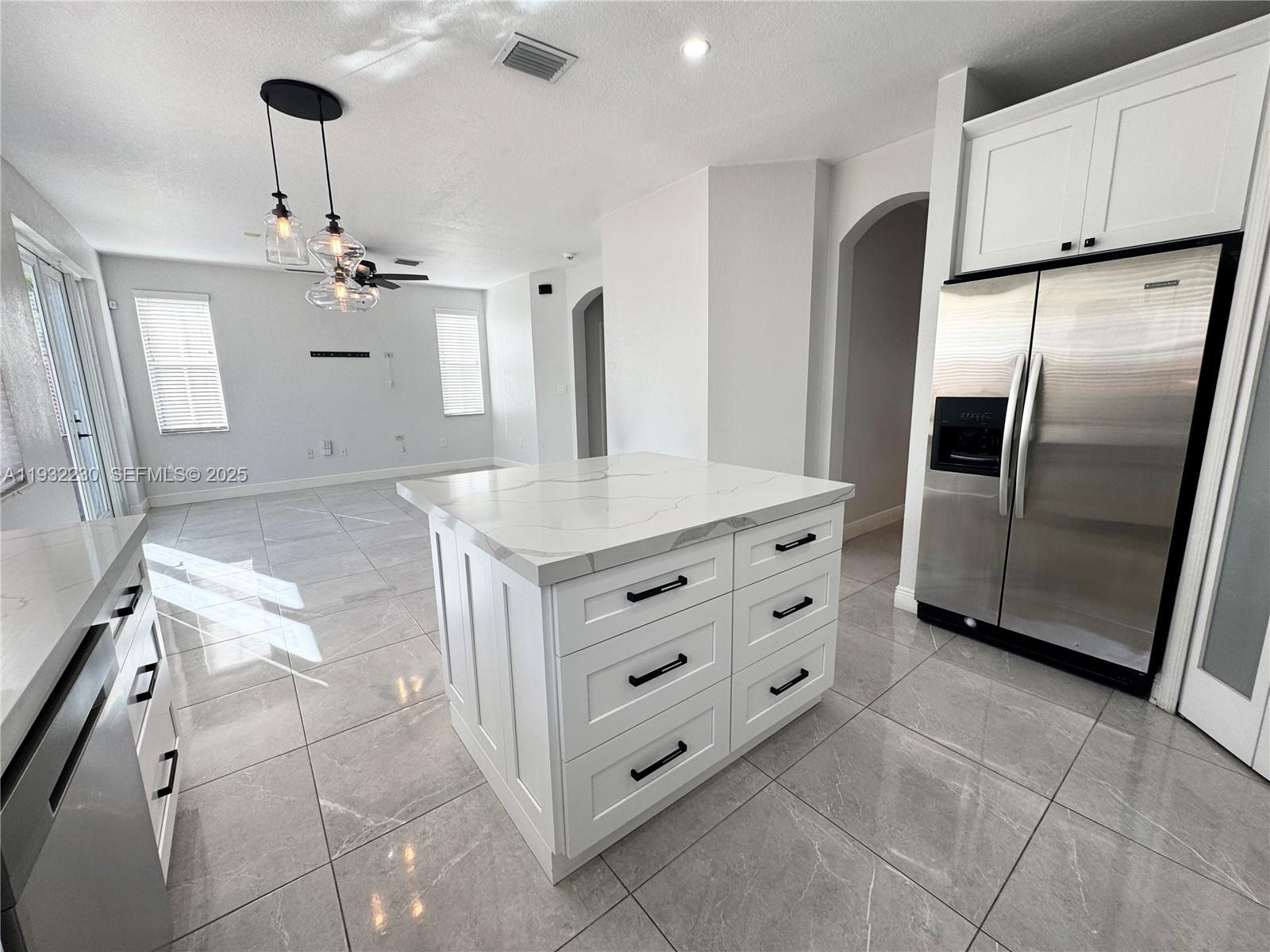 12283 Southwest 123rd Terrace Miami, FL 33186 - Photo 33 of 46 a kitchen with cabinets and stainless steel appliances