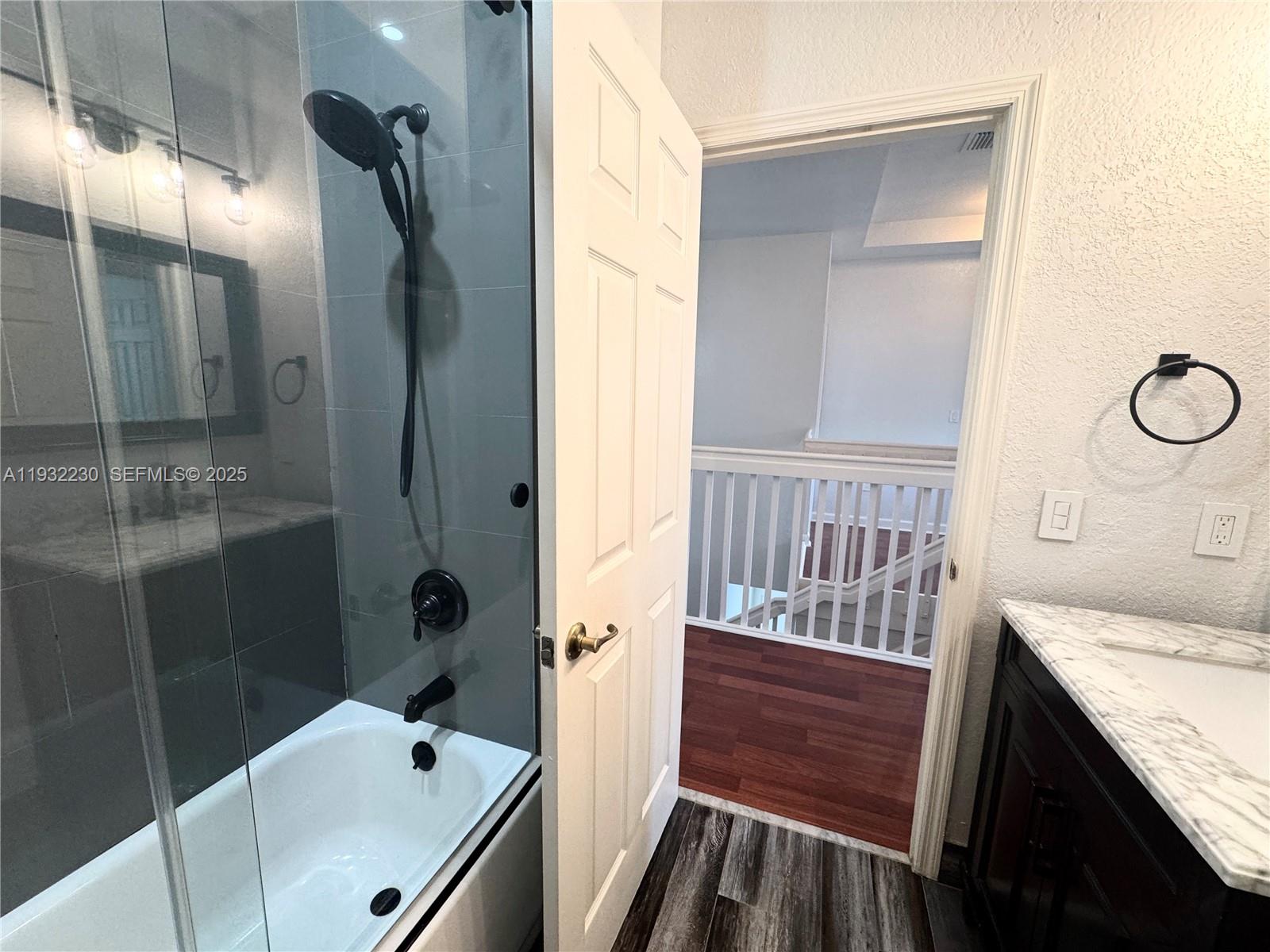 12283 Southwest 123rd Terrace Miami, FL 33186 - Photo 37 of 46 a bathroom with a tub and a sink