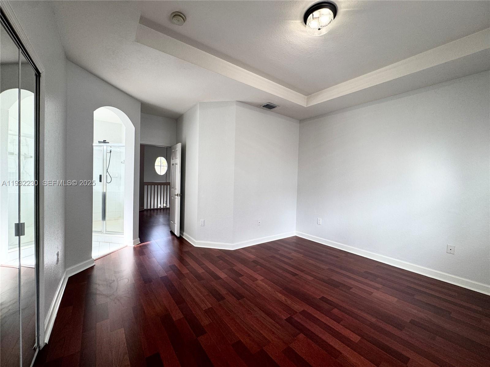 12283 Southwest 123rd Terrace Miami, FL 33186 - Photo 40 of 46 a view of empty room with wooden floor