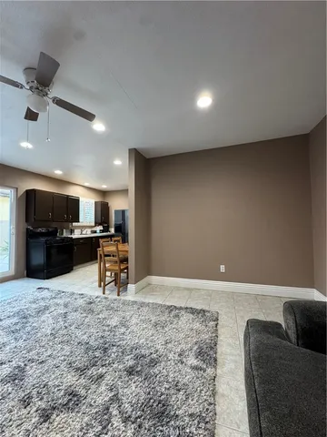 a view of kitchen with furniture and a refrigerator