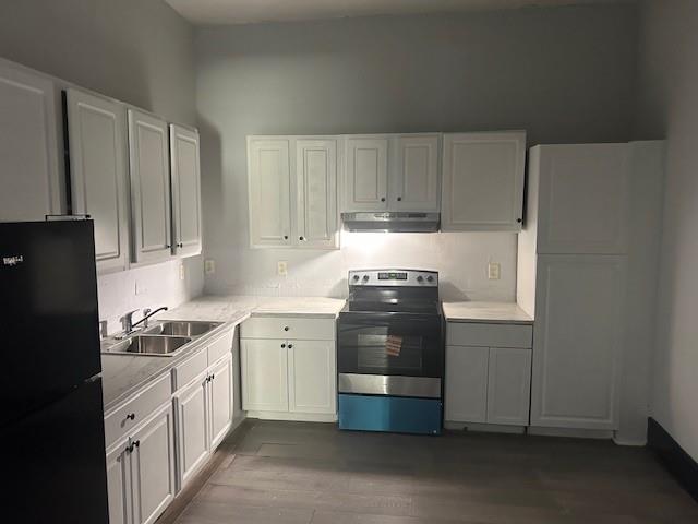 67 Daniel Street Southeast Atlanta, GA 30312 - Photo 11 of 23 a kitchen with stainless steel appliances a stove a refrigerator a sink and cabinets