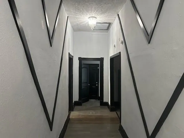 a view of a hallway with staircase