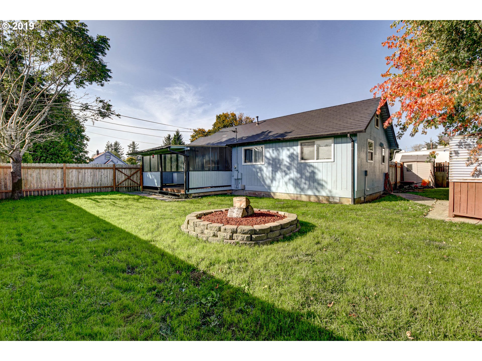 a view of house with backyard space and garden
