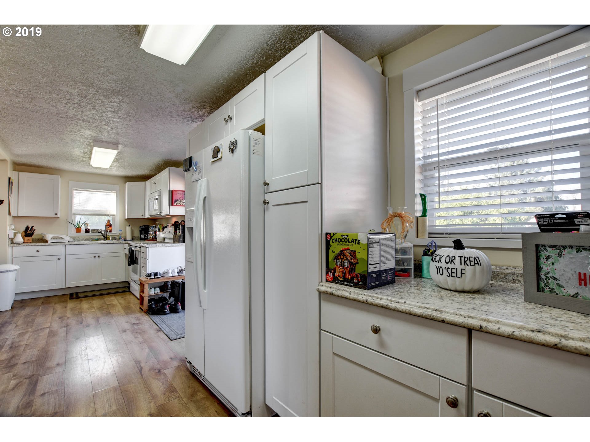 92411 Carnegie Road Astoria, OR 97103 - Photo 12 of 23 a kitchen with refrigerator and window