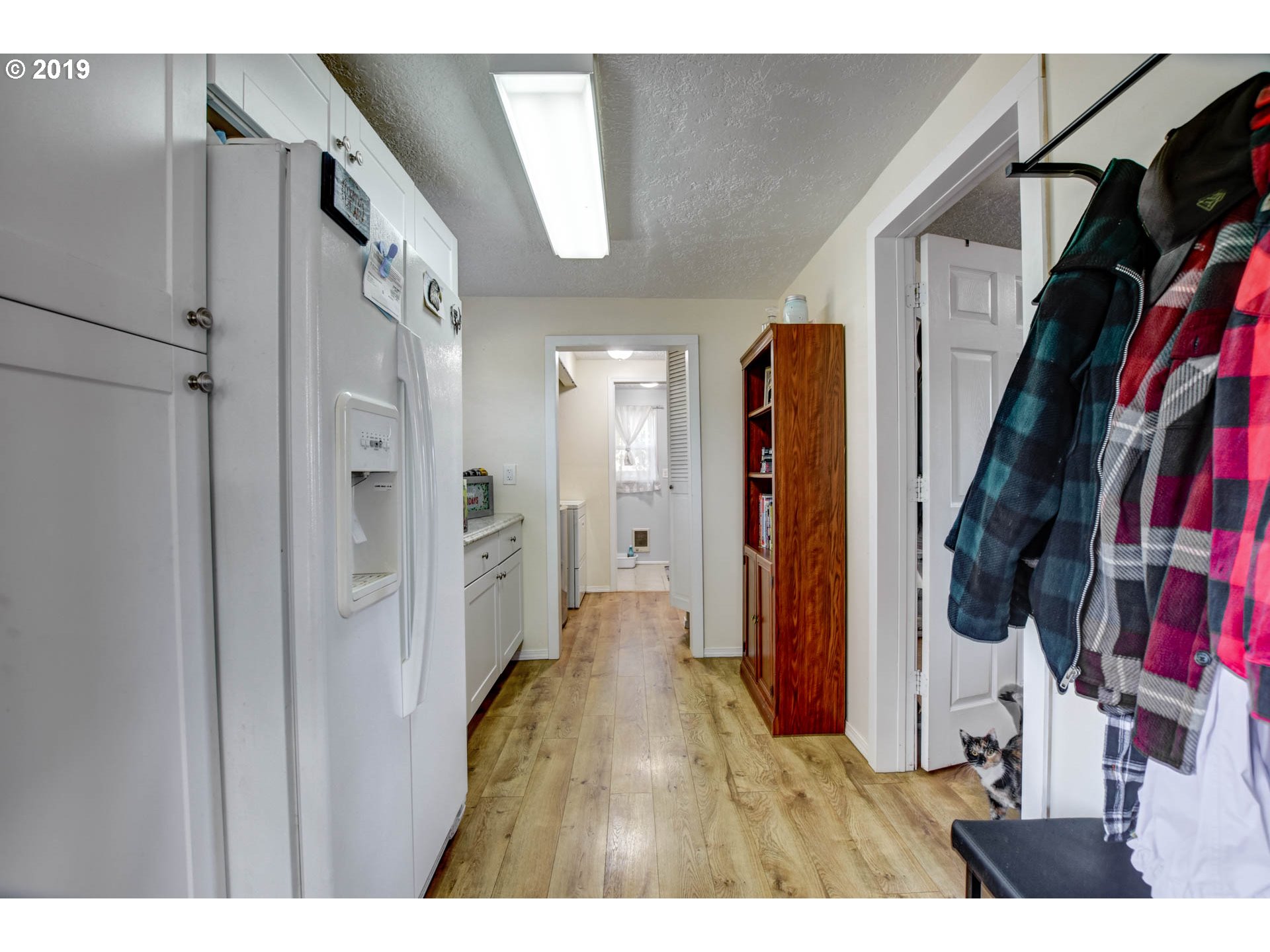 92411 Carnegie Road Astoria, OR 97103 - Photo 13 of 23 a view of walk in closet with clothes and shoes
