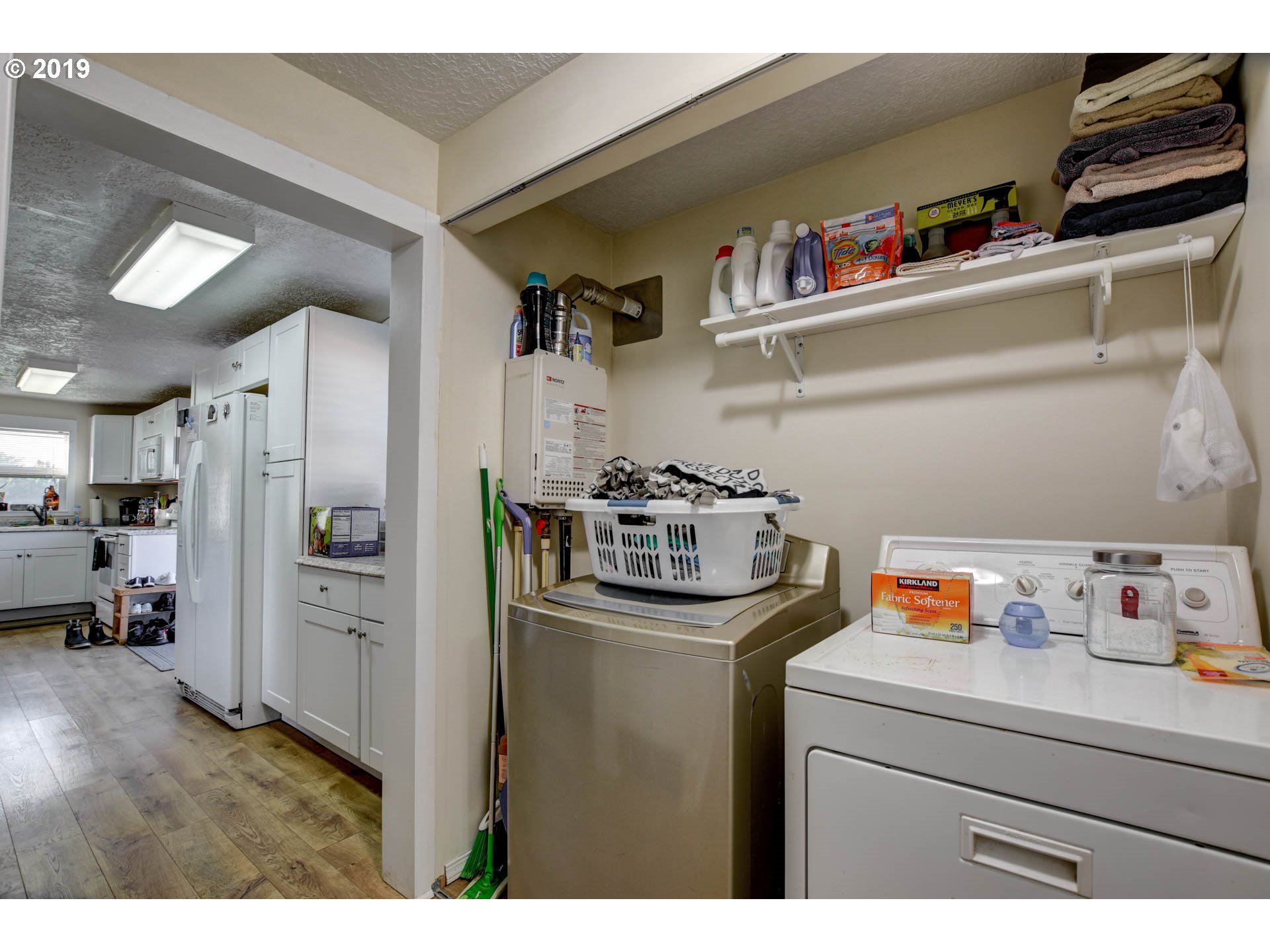 92411 Carnegie Road Astoria, OR 97103 - Photo 14 of 23 a kitchen with stainless steel appliances granite countertop a refrigerator and a sink