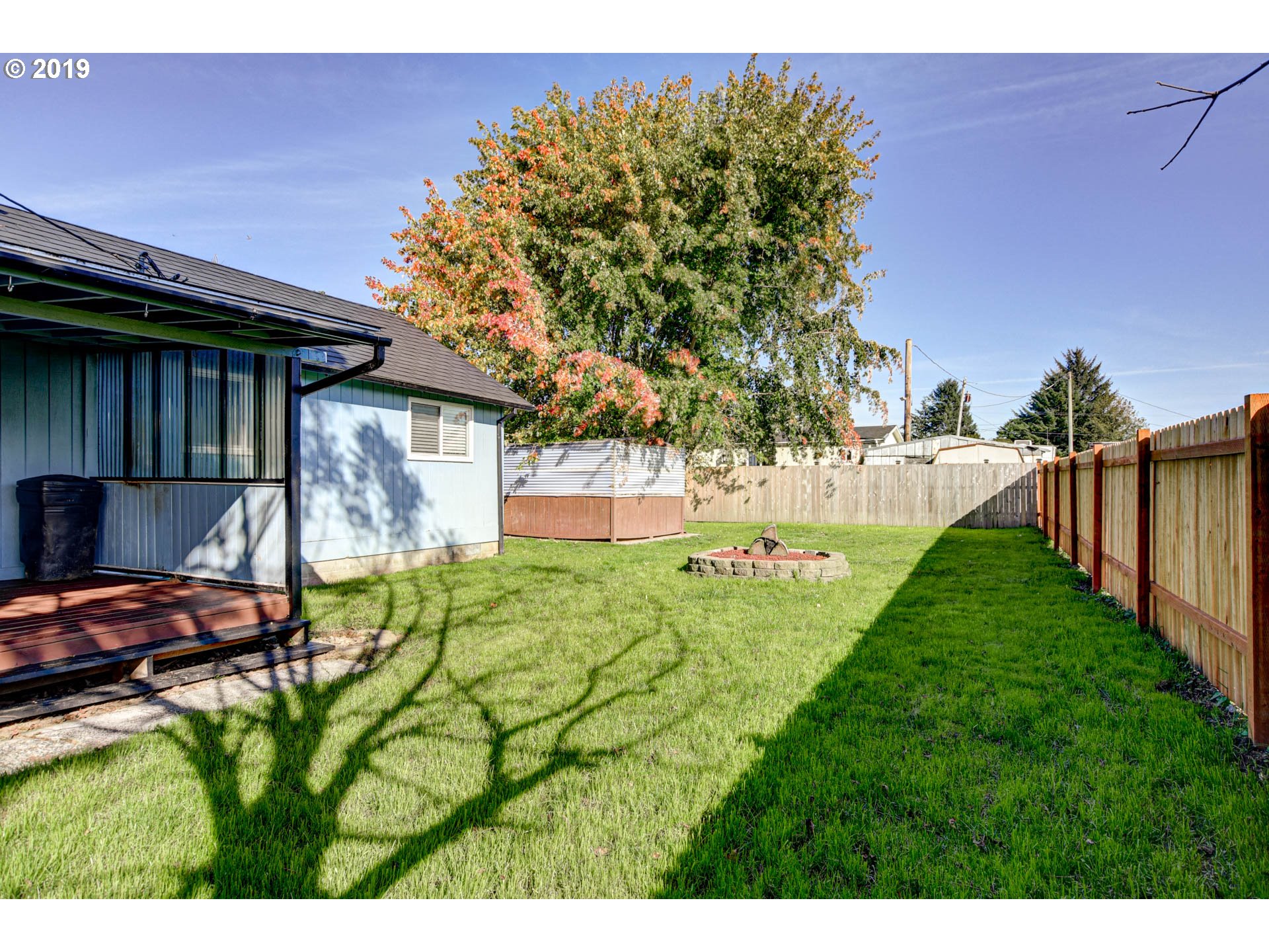 92411 Carnegie Road Astoria, OR 97103 - Photo 19 of 23 a view of backyard with swimming pool and outdoor seating