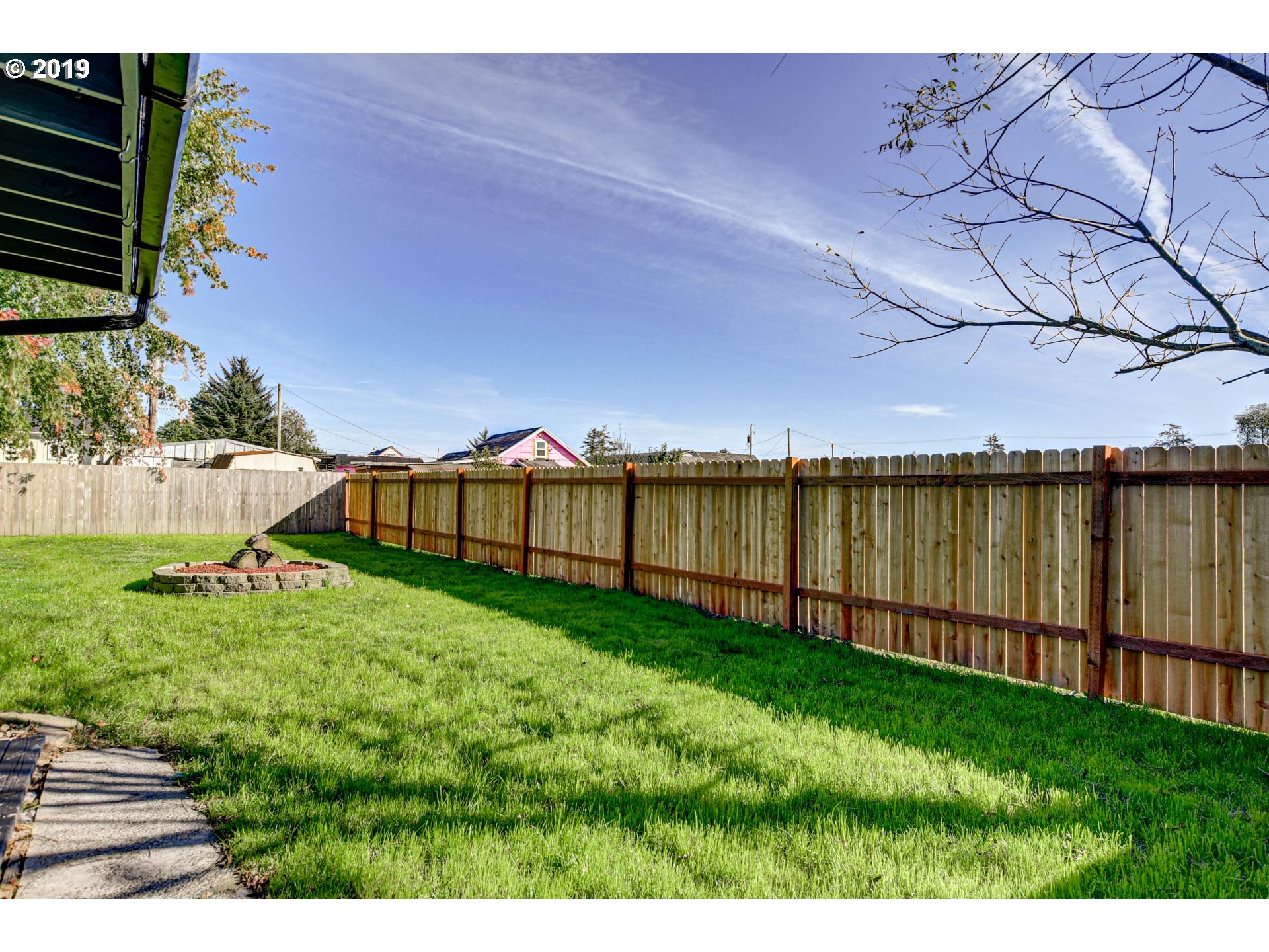 92411 Carnegie Road Astoria, OR 97103 - Photo 20 of 23 a view of a backyard with a garden