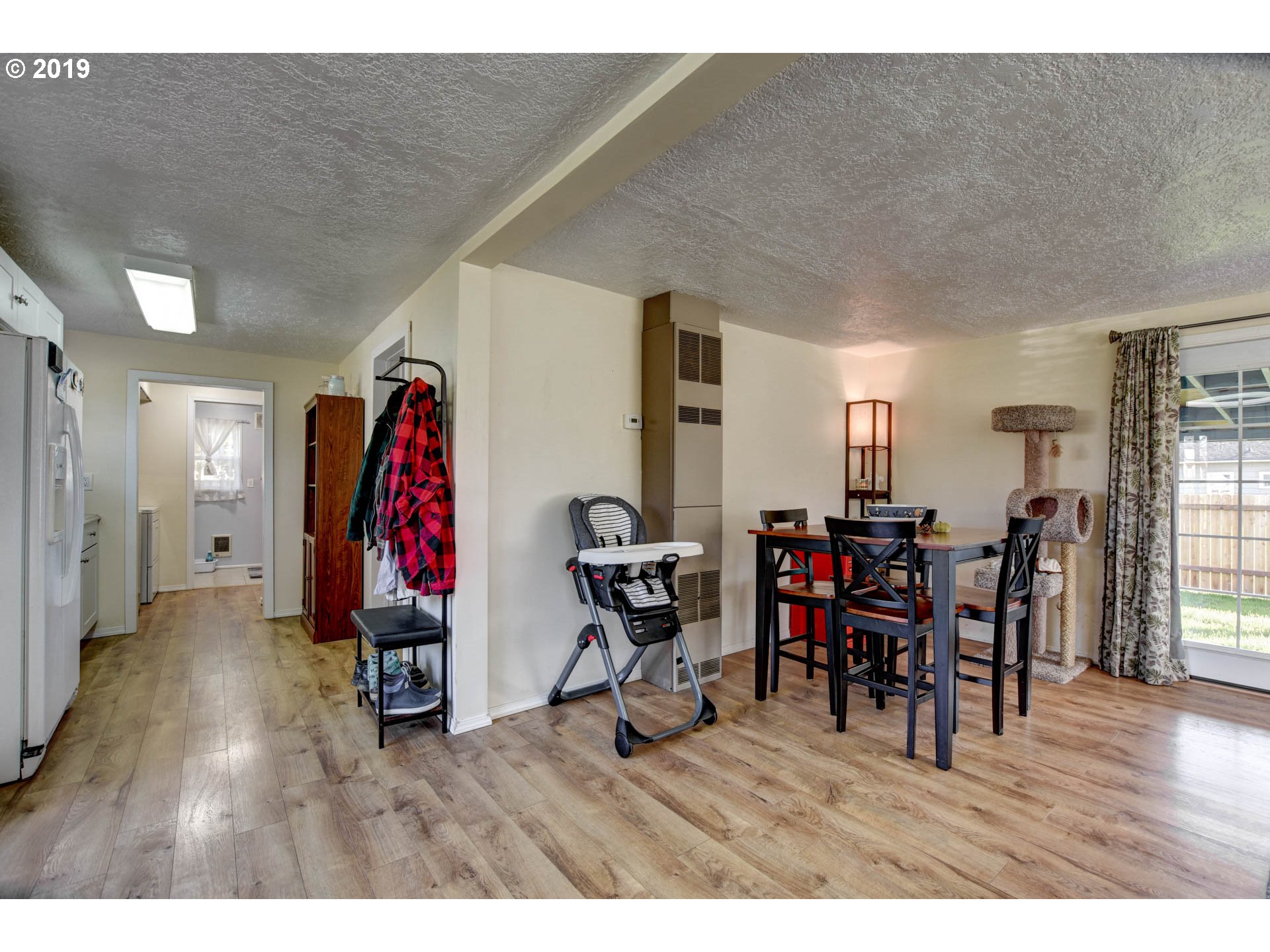 92411 Carnegie Road Astoria, OR 97103 - Photo 5 of 23 a view of a dining room with furniture and wooden floor