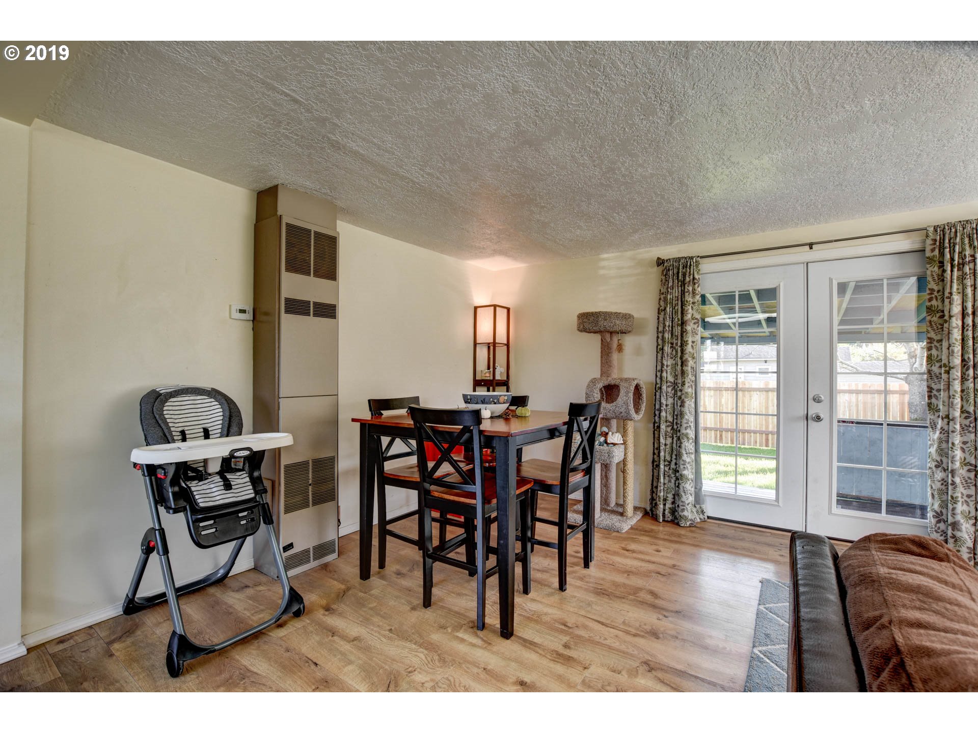 92411 Carnegie Road Astoria, OR 97103 - Photo 6 of 23 a view of a dining room with furniture and wooden floor