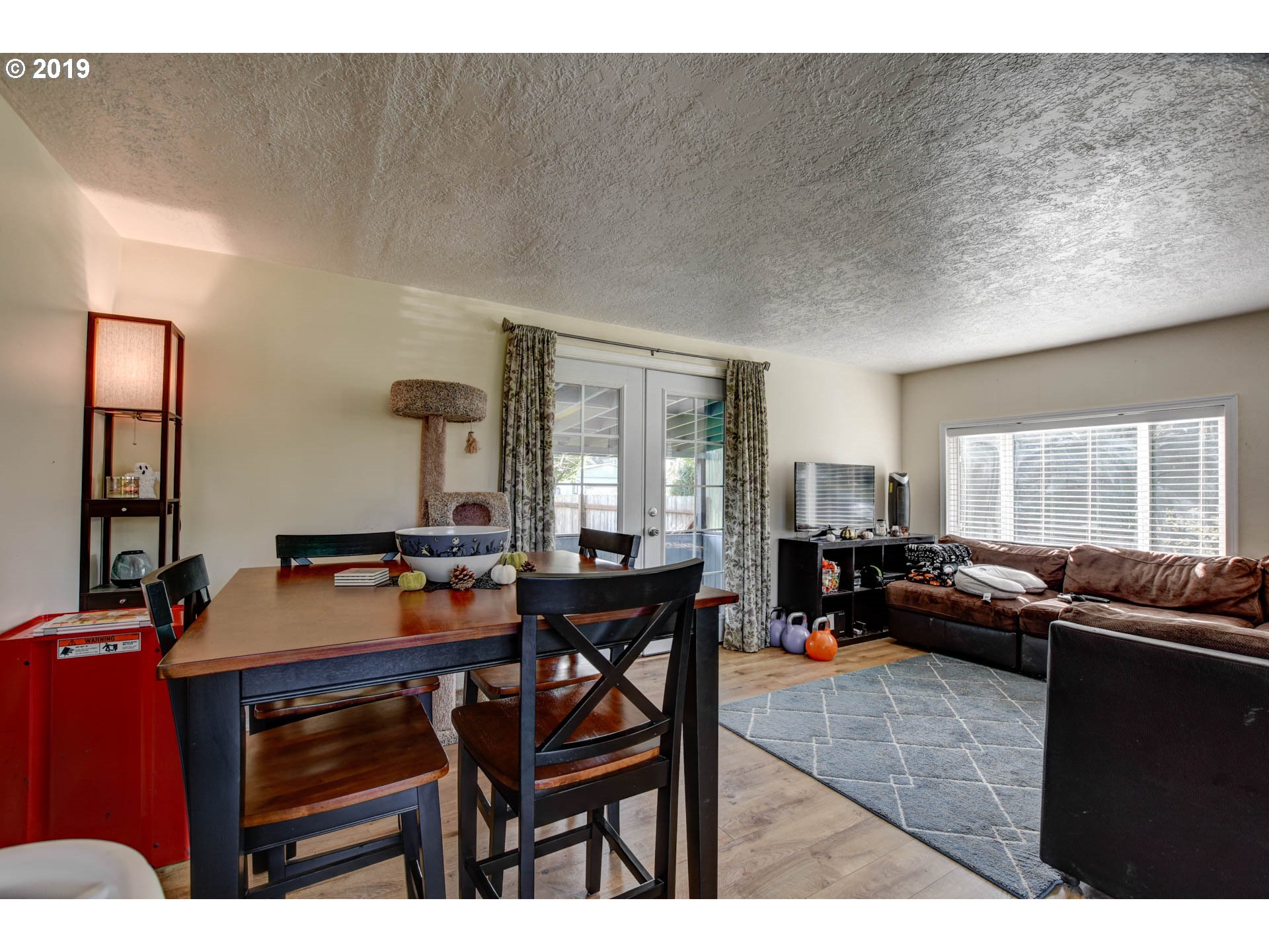 92411 Carnegie Road Astoria, OR 97103 - Photo 7 of 23 a living room with furniture and a large window