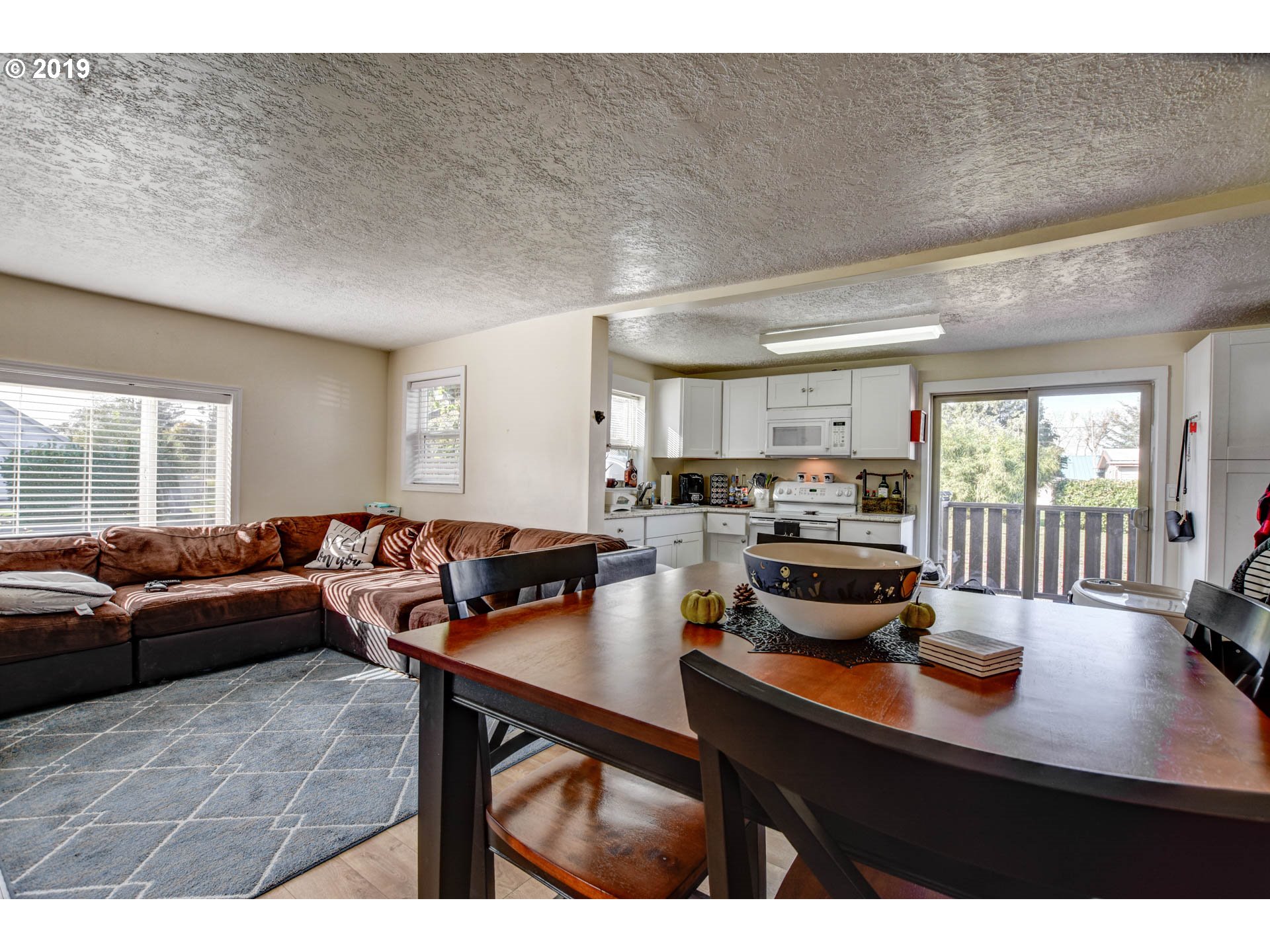 92411 Carnegie Road Astoria, OR 97103 - Photo 9 of 23 a living room with furniture and a window