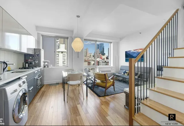 a view of a living room and dining room