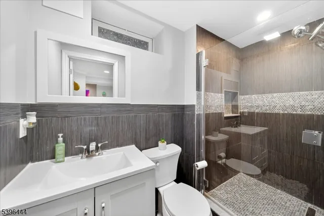 a view of a room with gym equipment and a window