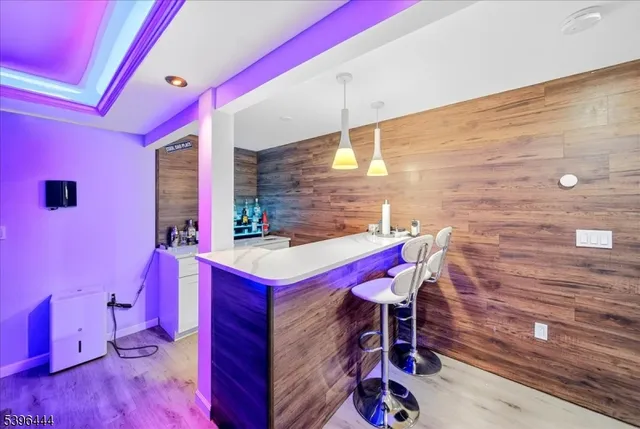 a dinning area with furniture and a floor to ceiling window