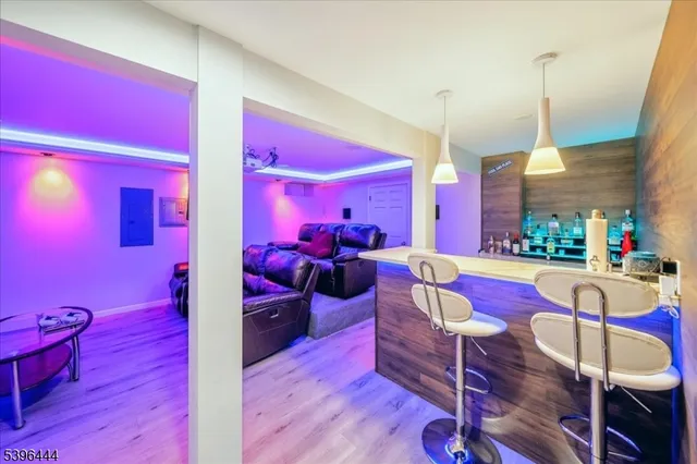 a bathroom with a granite countertop sink mirror vanity and toilet