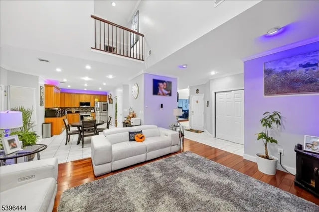 a living room with a flat screen tv and a fireplace