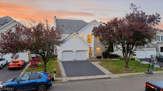 a view of a parked cars in front of a house
