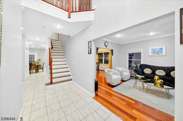 a bedroom with bed and wooden floor