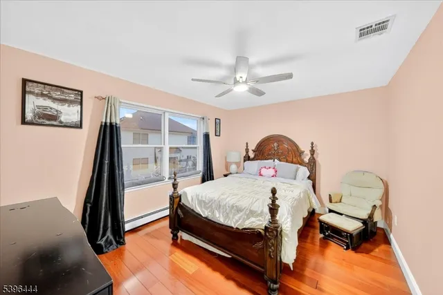 a view of balcony with chairs and wooden floor