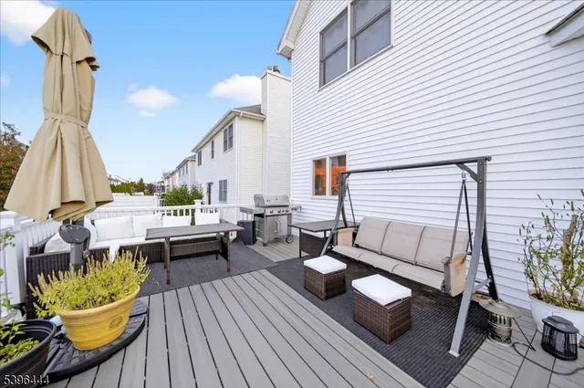 a view of a balcony with couch and wooden floor