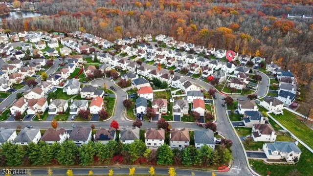 an aerial view of residential houses with outdoor space and street view