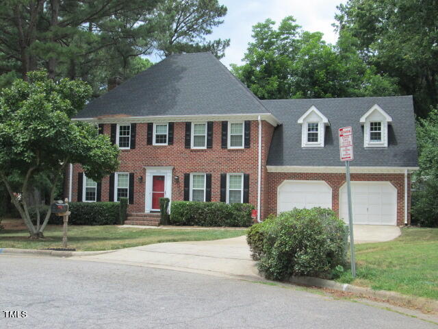 200 Raindrop Court Raleigh, NC 27615 - Photo 1 of 61 a front view of a house with a garden