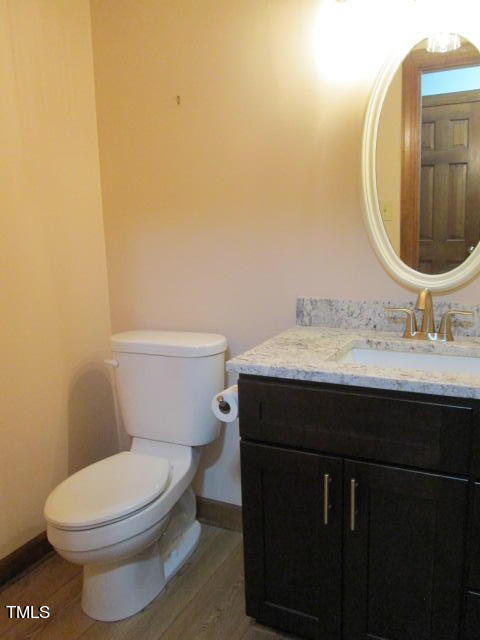 200 Raindrop Court Raleigh, NC 27615 - Photo 16 of 61 a bathroom with a sink vanity mirror and toilet